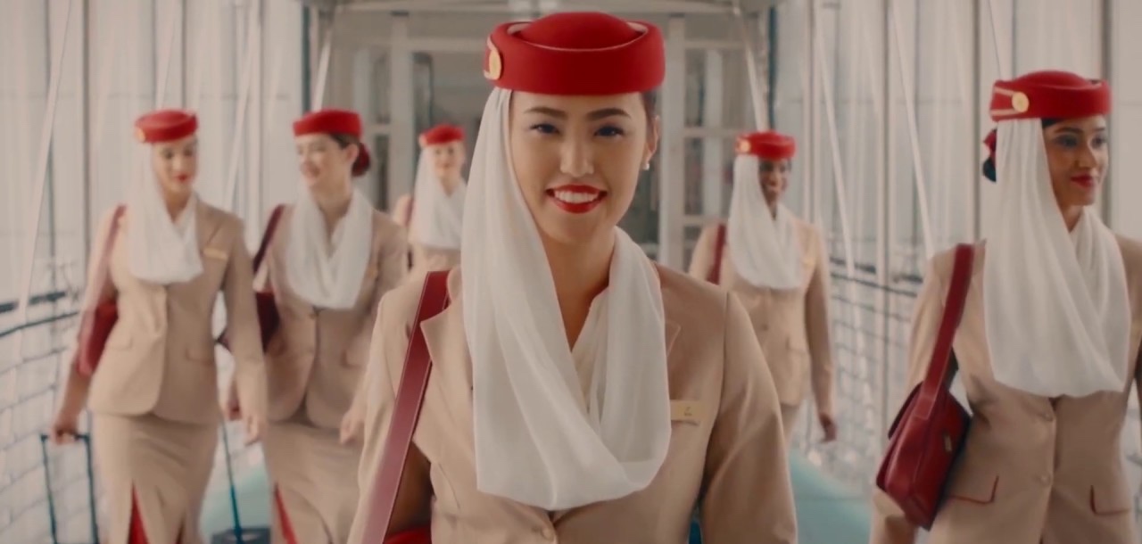 a woman wearing a red hat and white scarf