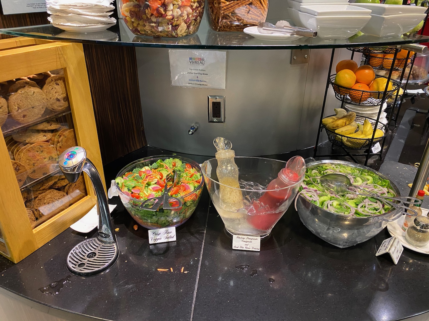 a salad bowls and a glass bowl on a counter