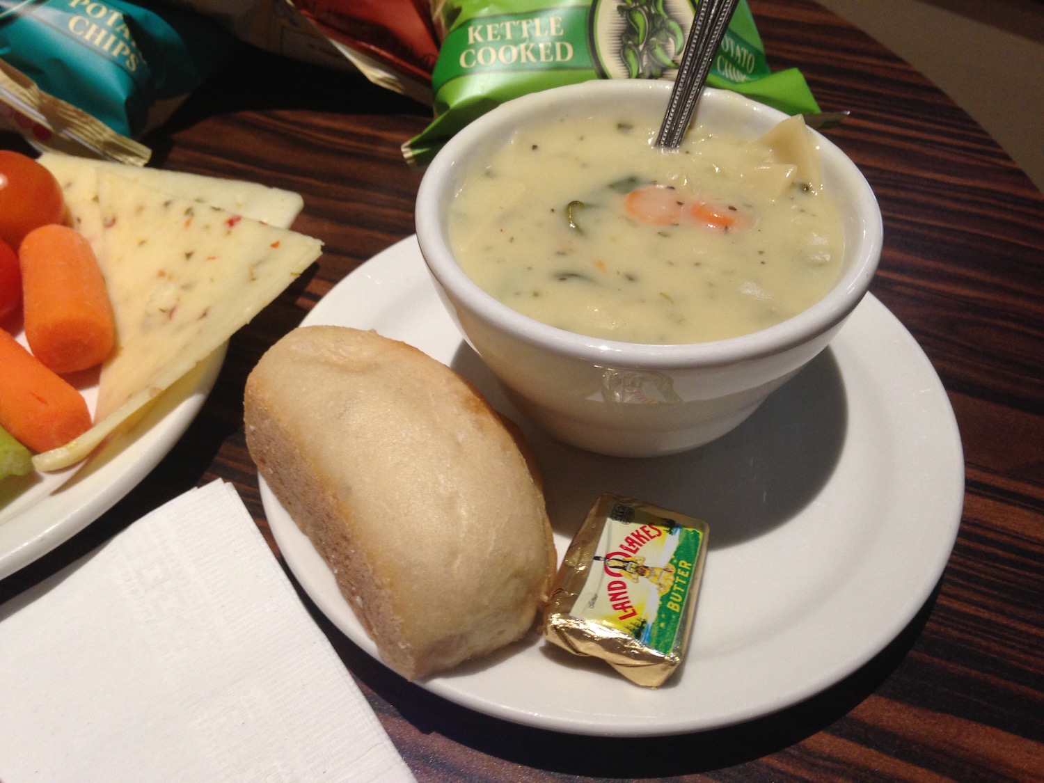 a bowl of soup and bread on a plate