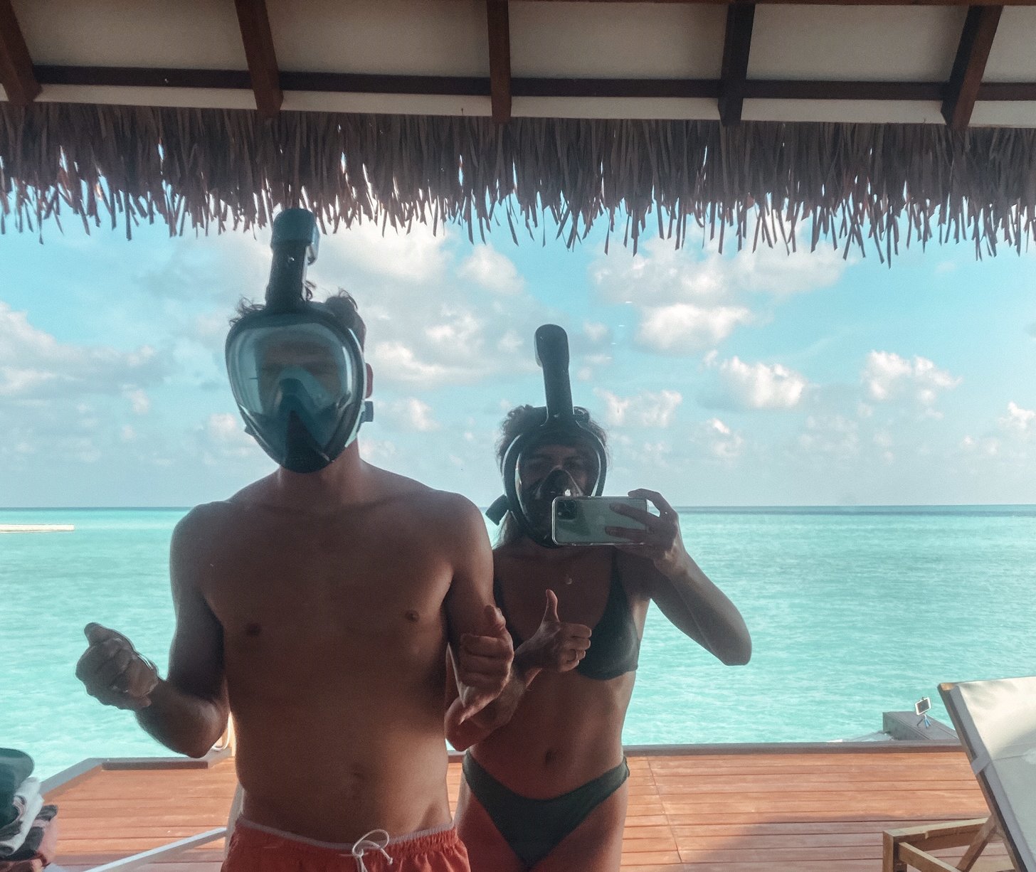 a couple of people wearing snorkeling masks