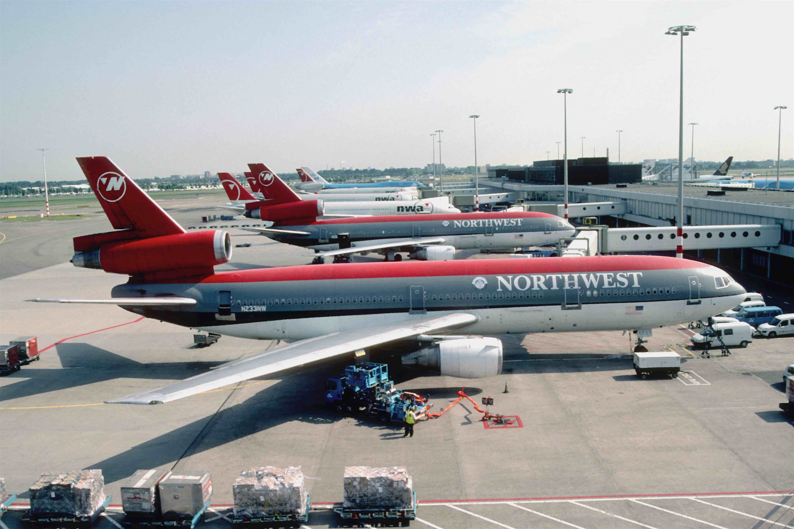 a group of airplanes at an airport