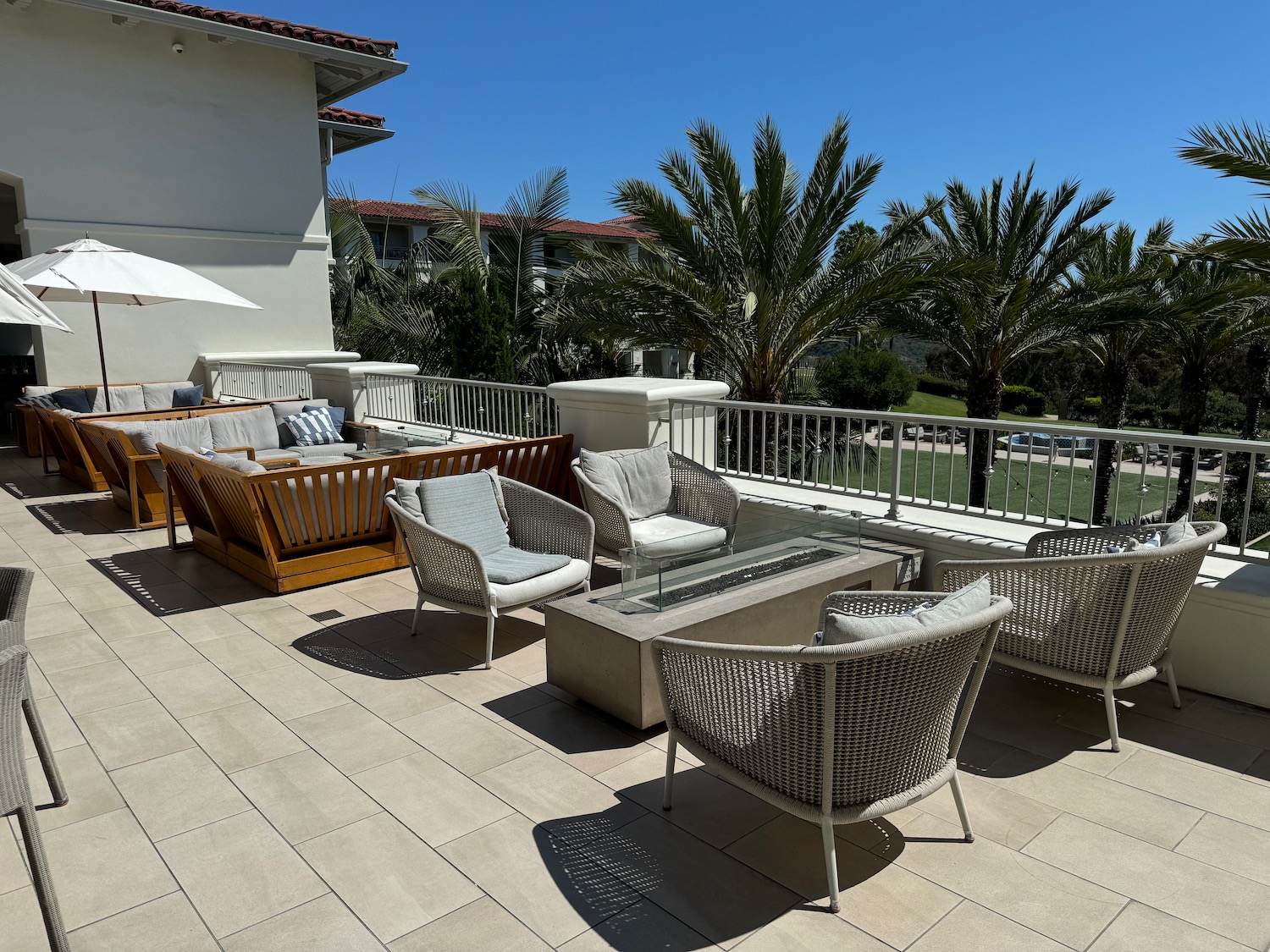 a patio with chairs and a table