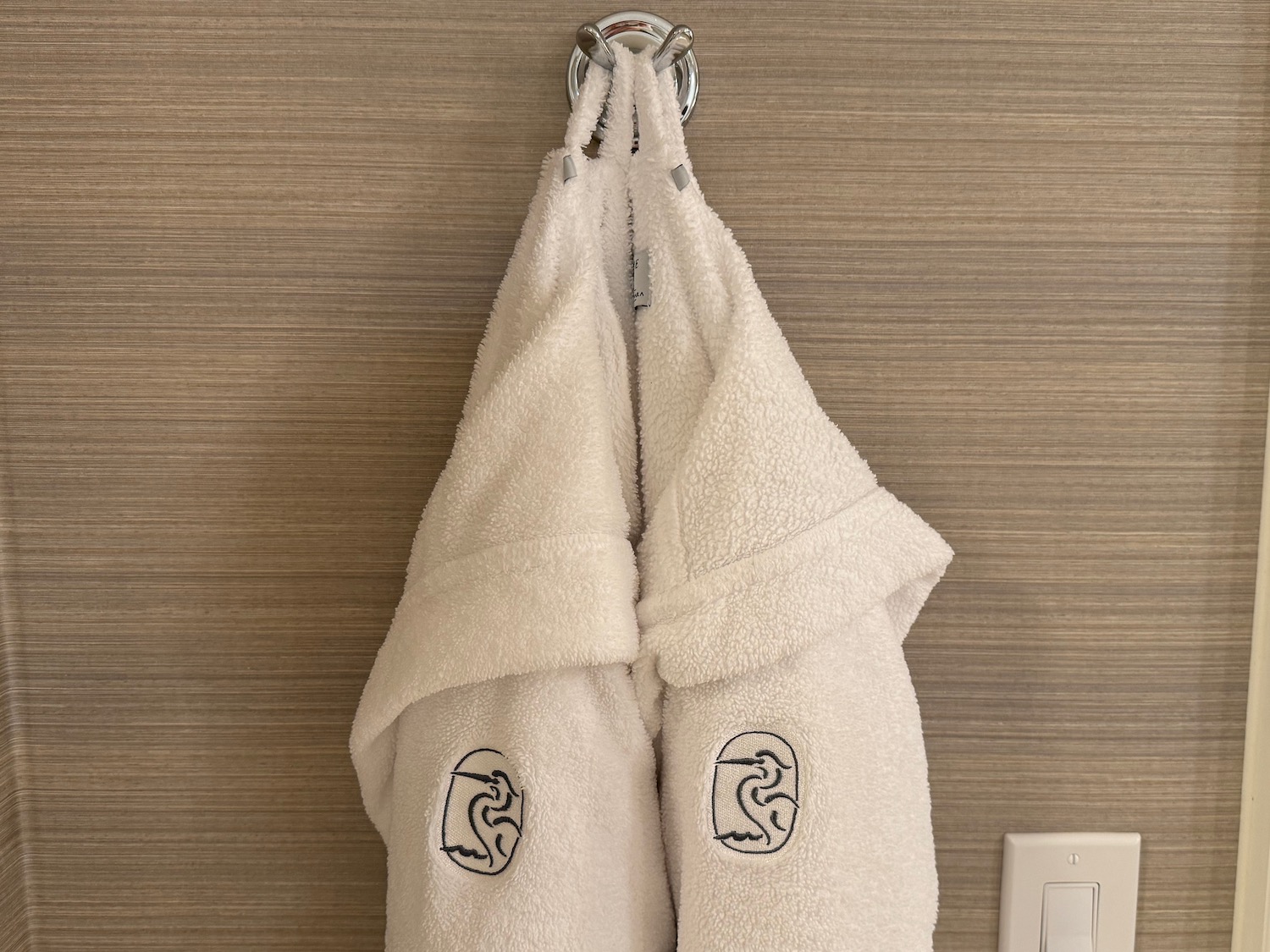 a white towels on a hook