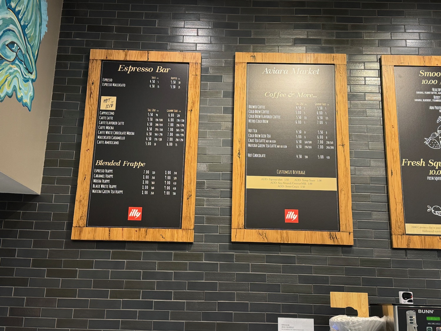 a black board with wood frames on a brick wall