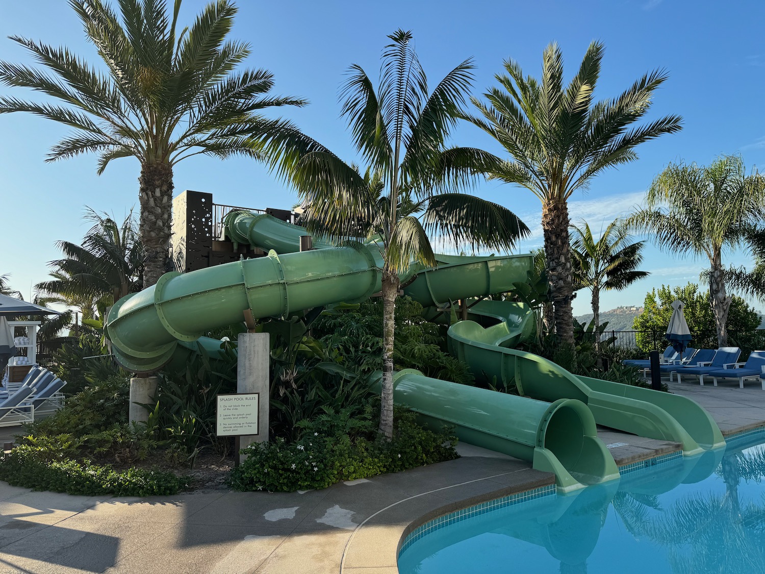 a water slide next to a pool