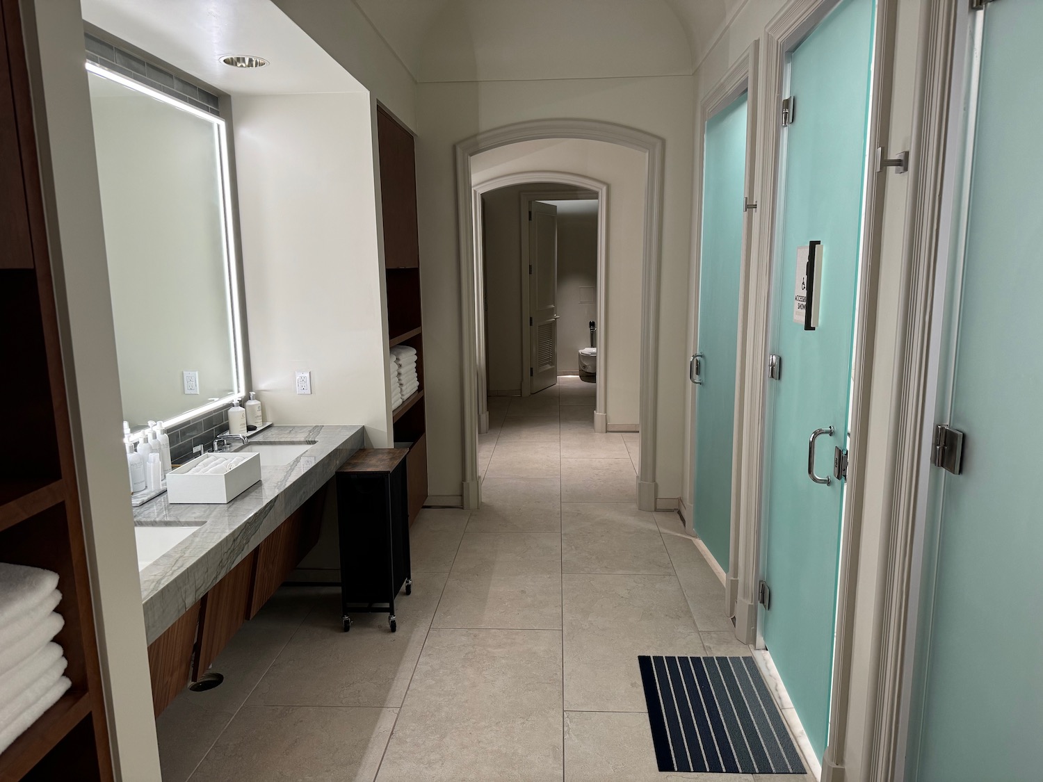 a bathroom with a blue door and a sink