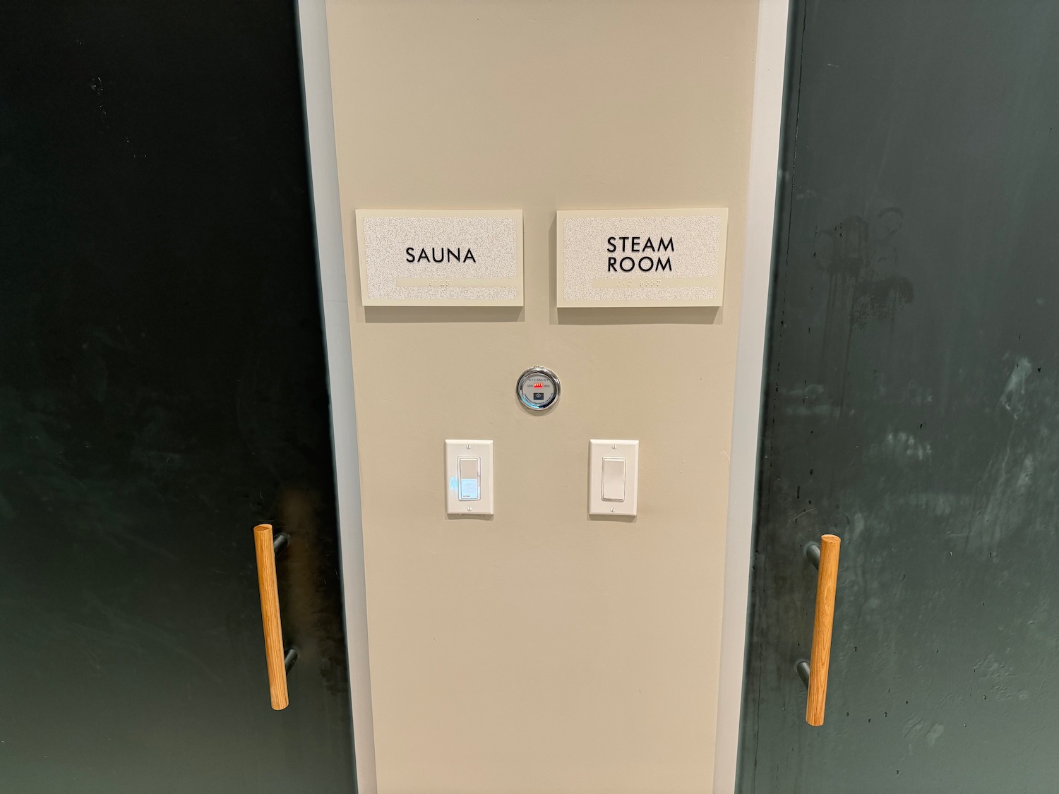 a door with a sign and switches