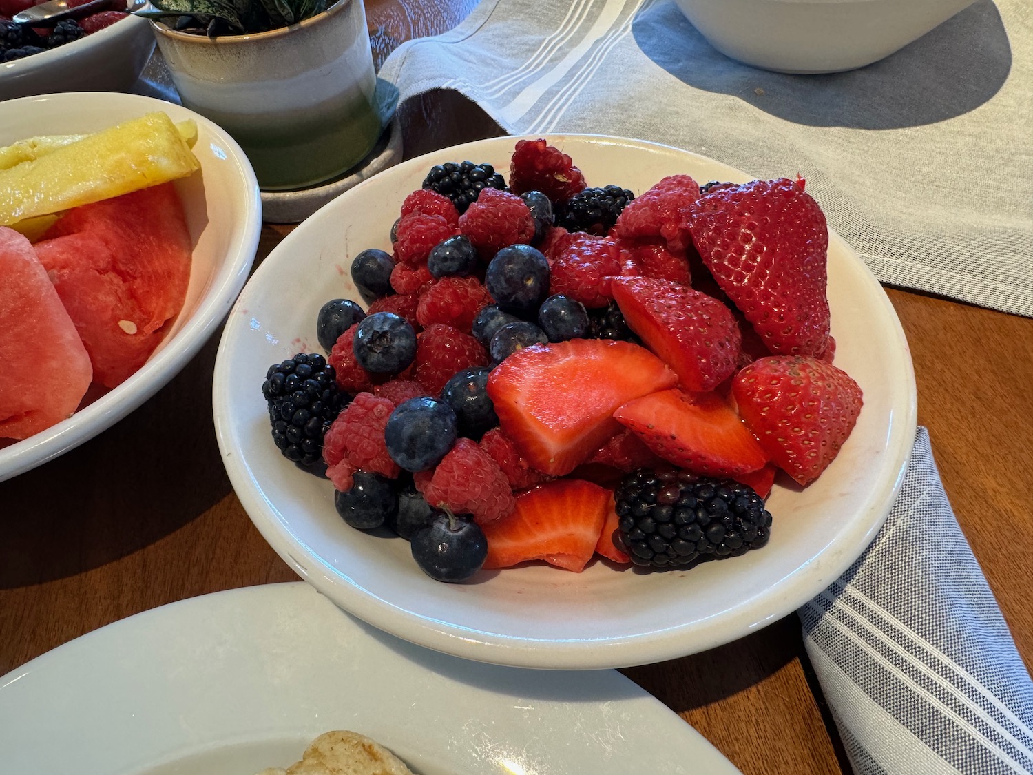 a bowl of fruit on a table