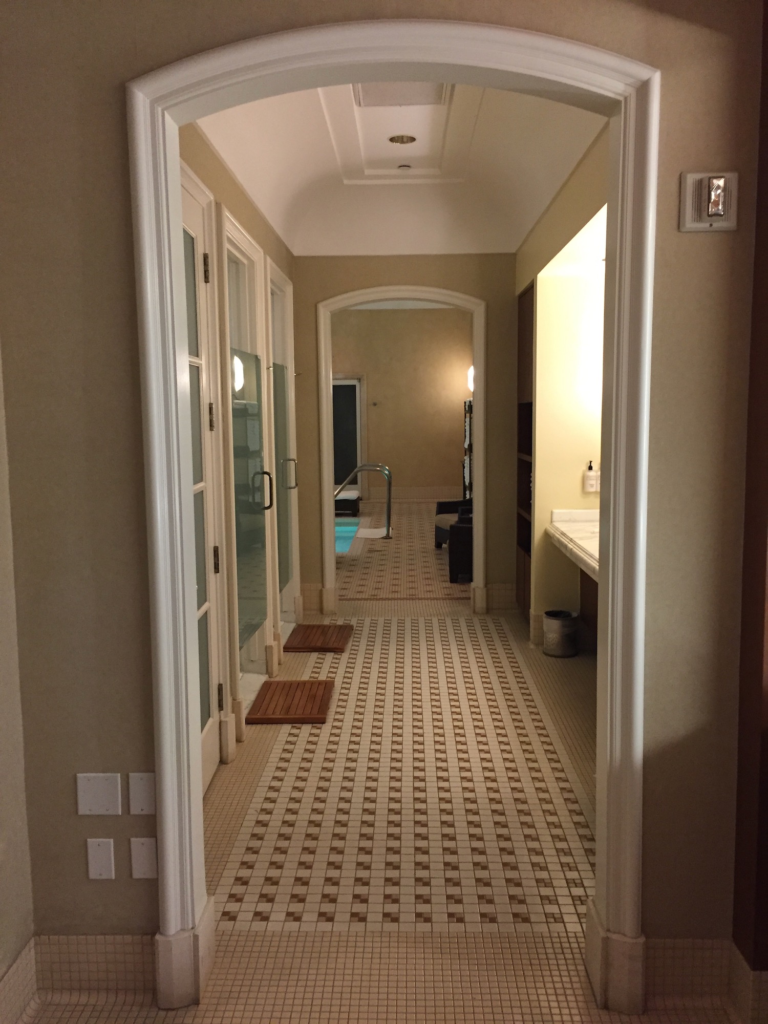 a hallway with a tiled floor