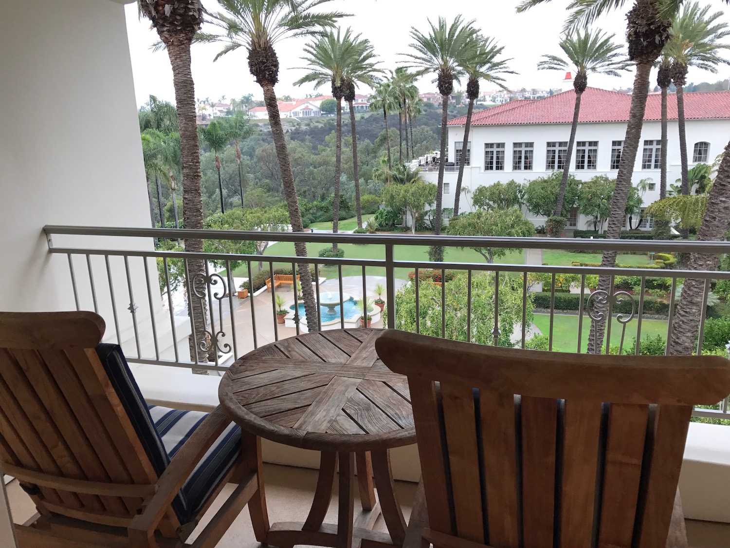 a table and chairs on a balcony