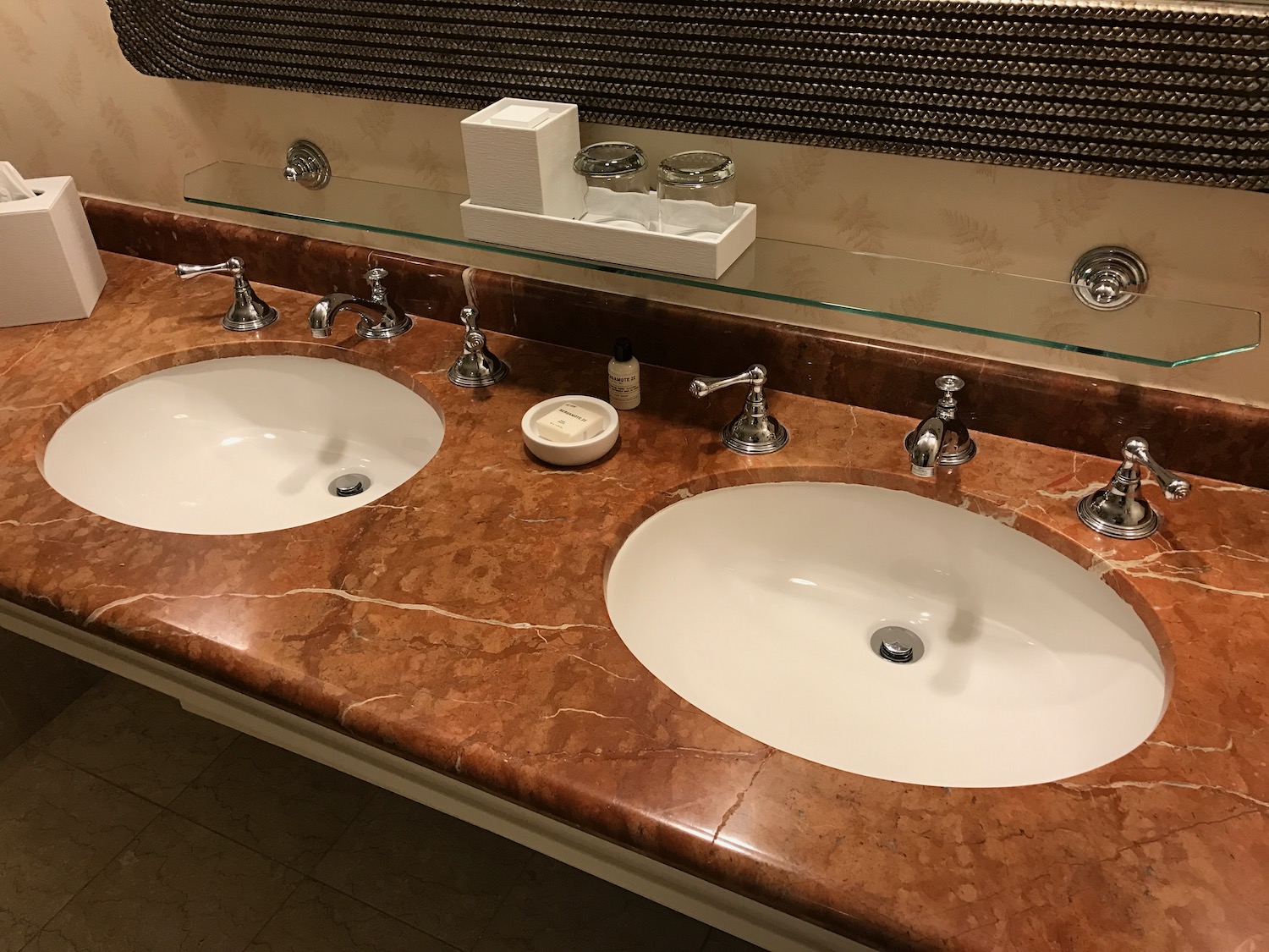 a bathroom sink with a mirror above it