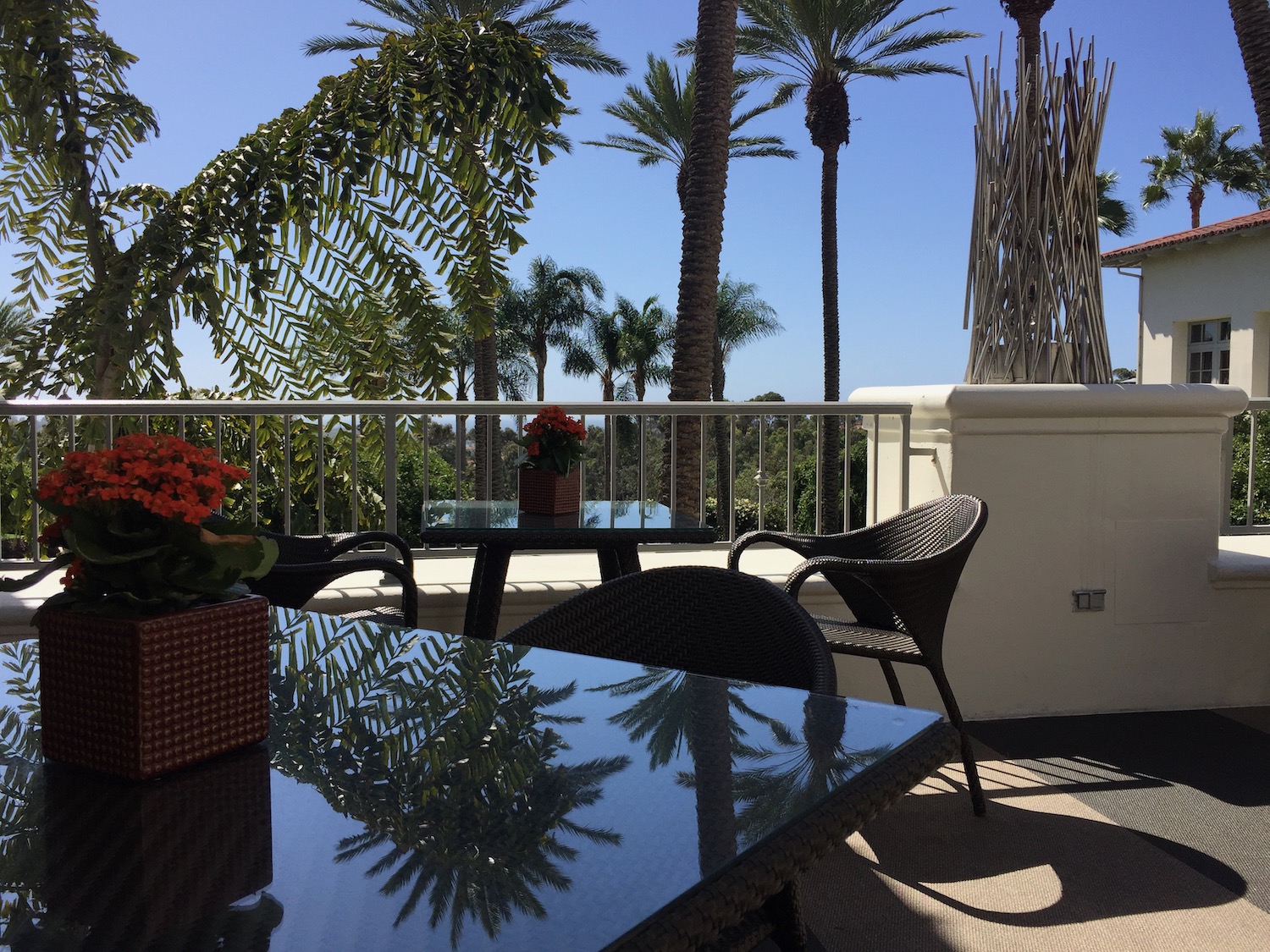 a table and chairs on a balcony