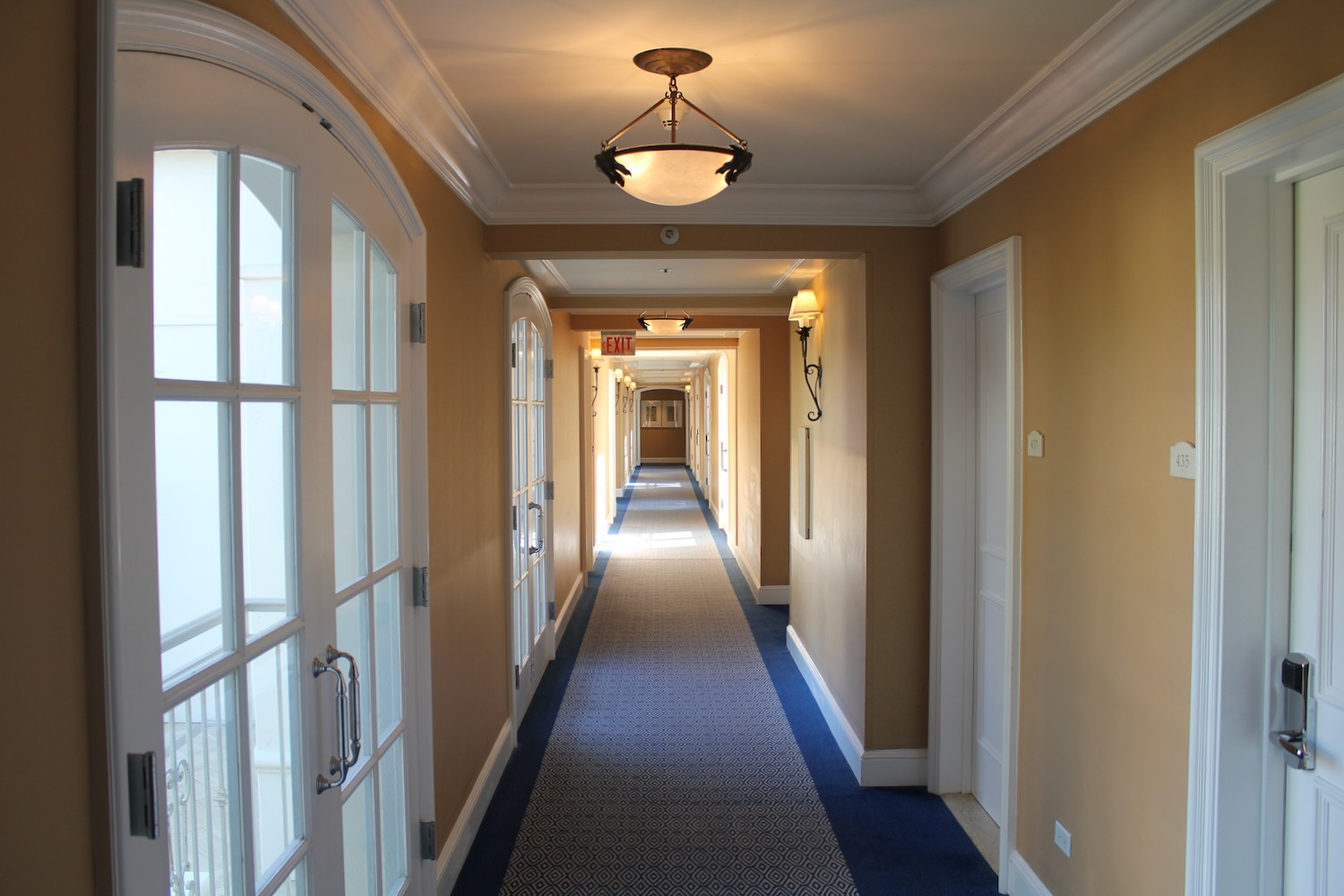 a long hallway with a light fixture