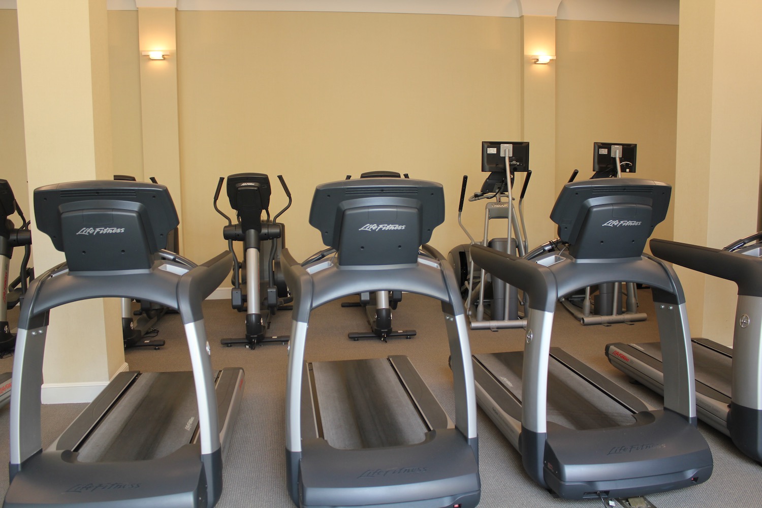 a group of treadmills in a gym