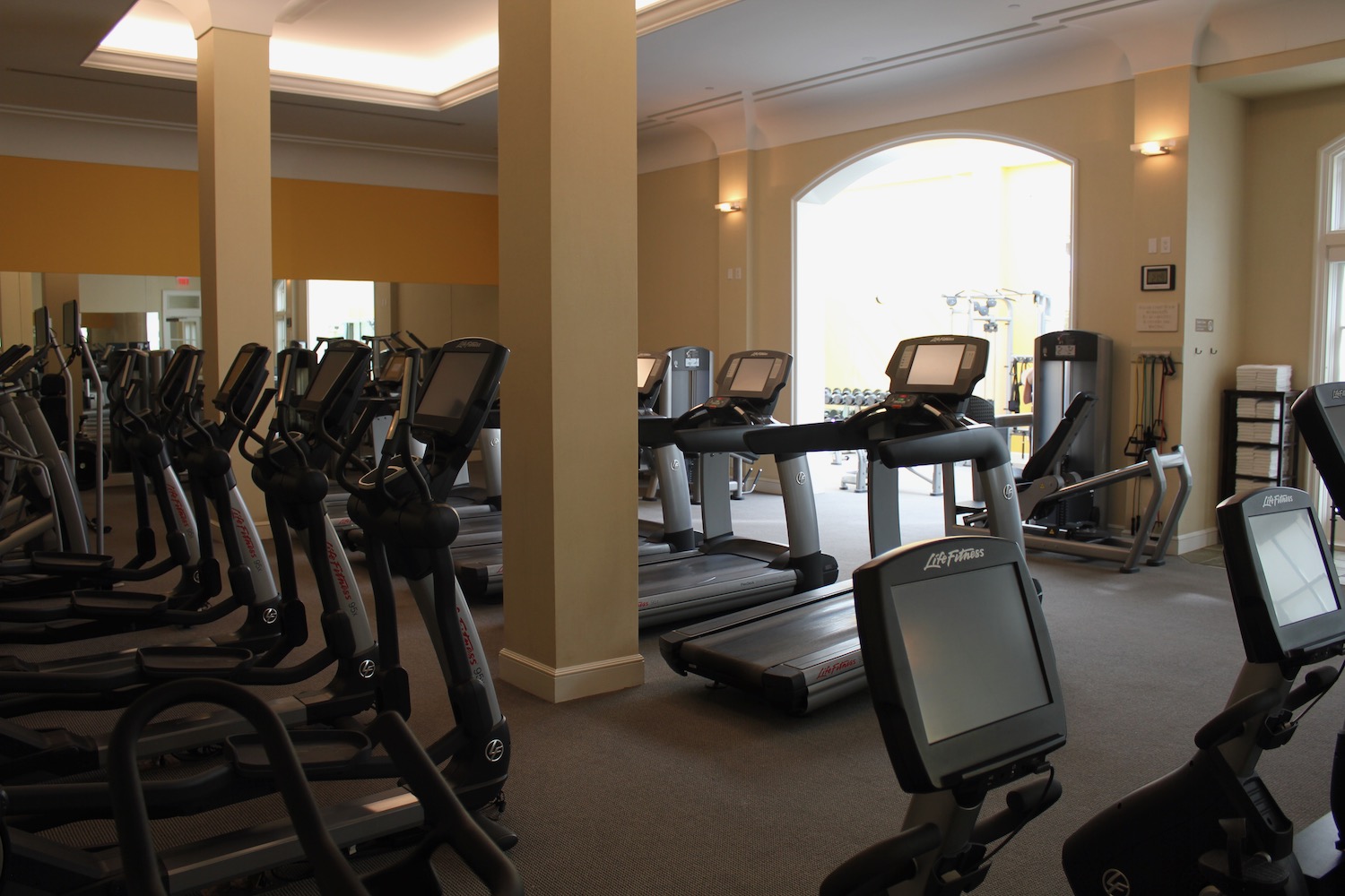 a room with treadmills and exercise machines