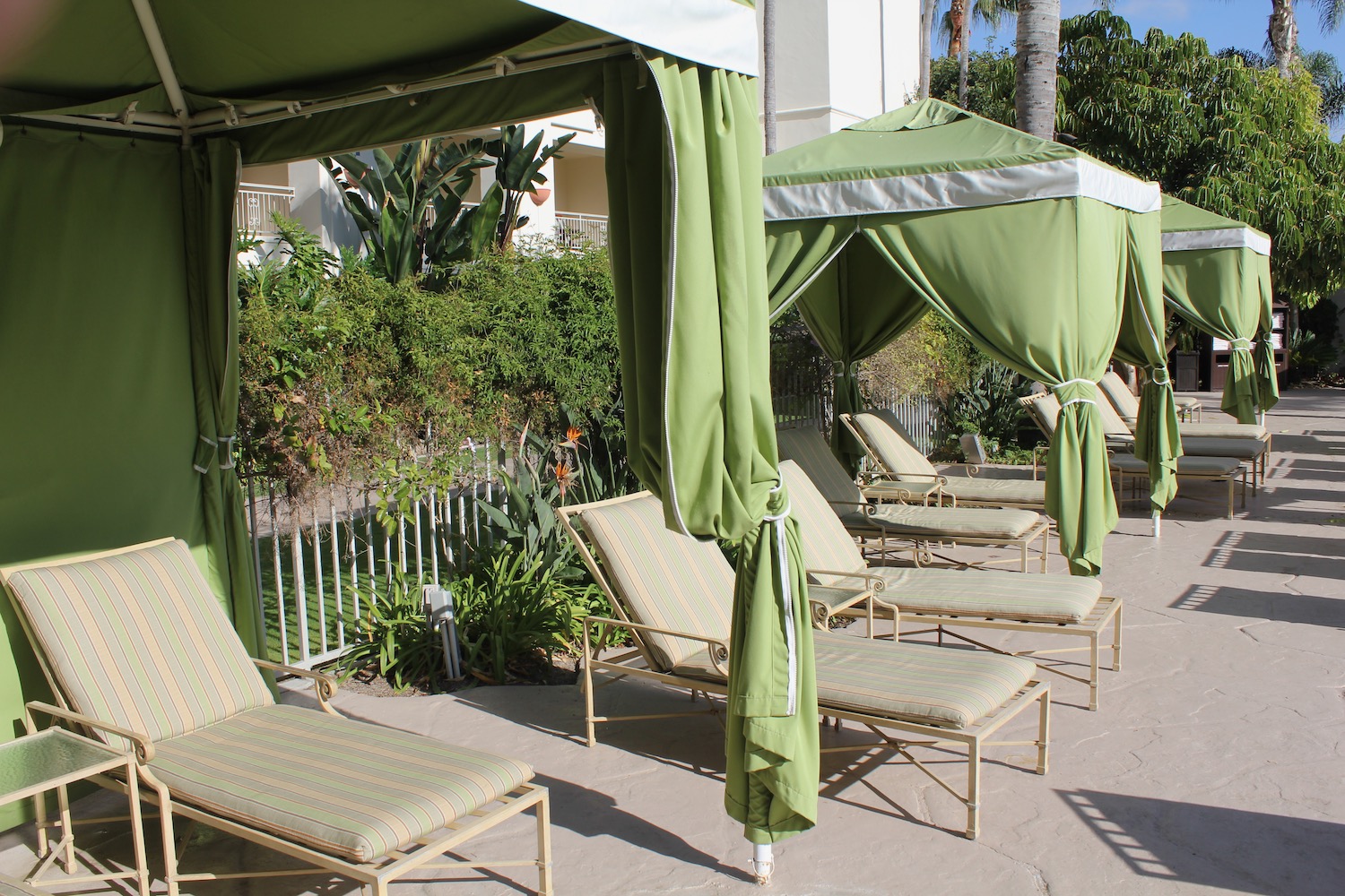 a group of lounge chairs and a canopy