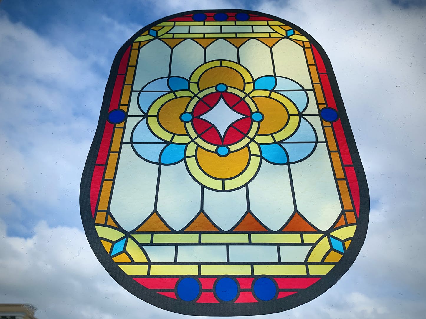 a stained glass window with a colorful design