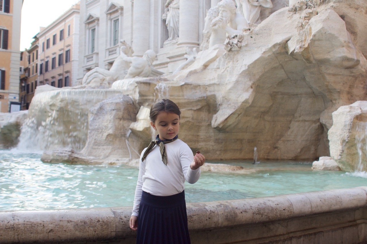 Throwing coins in Trevi Fountain still dressed as Audrey Hepburn in Roman Holiday