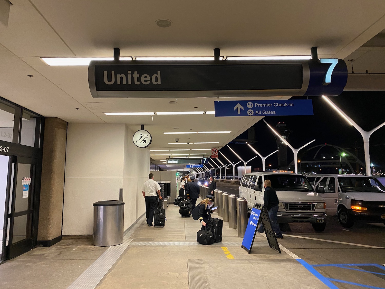 people with luggage in a terminal