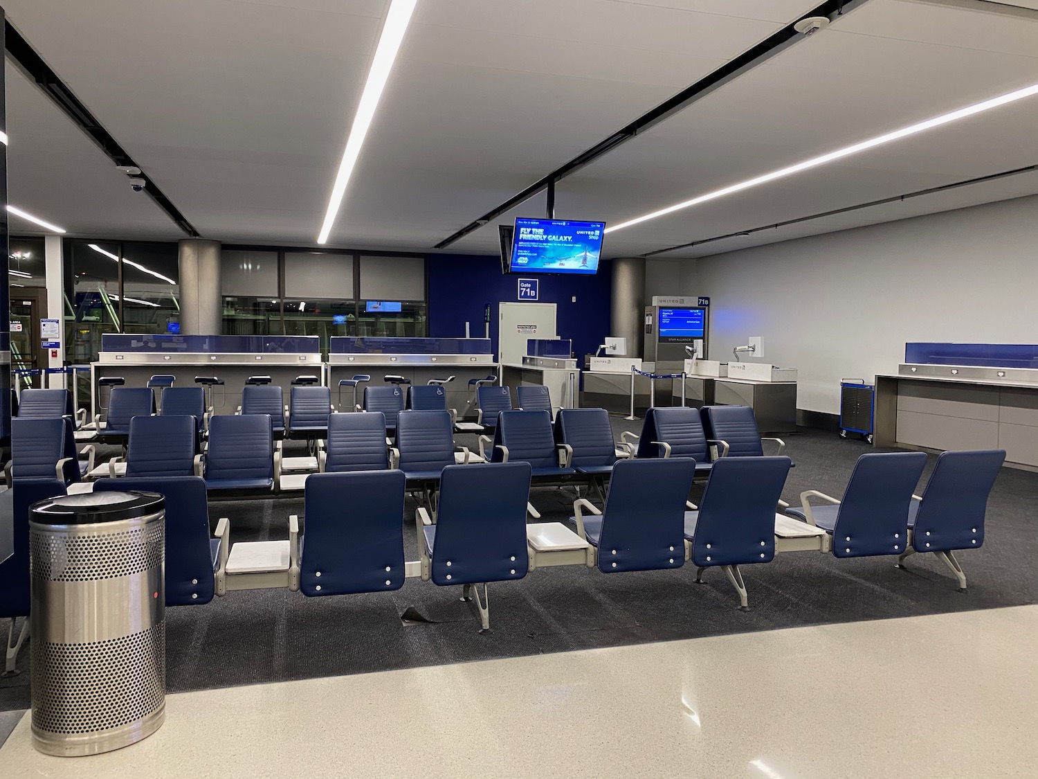 a row of chairs in an airport