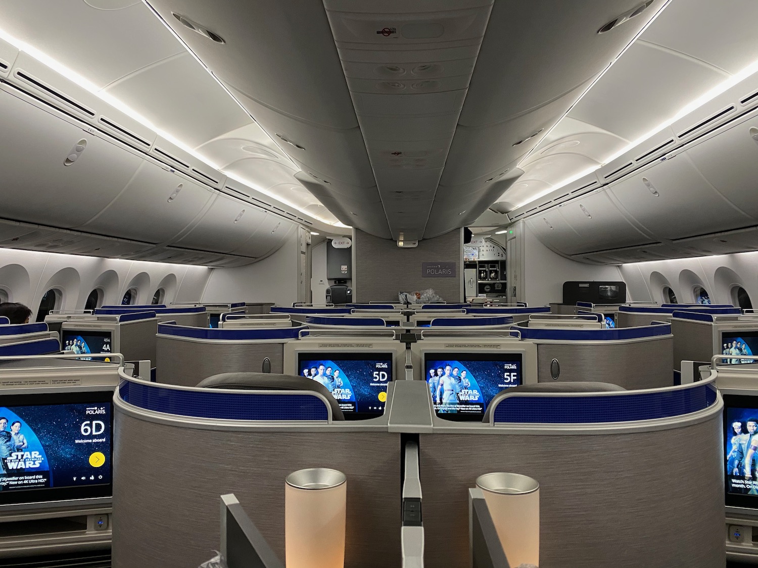 an airplane with seats and monitors