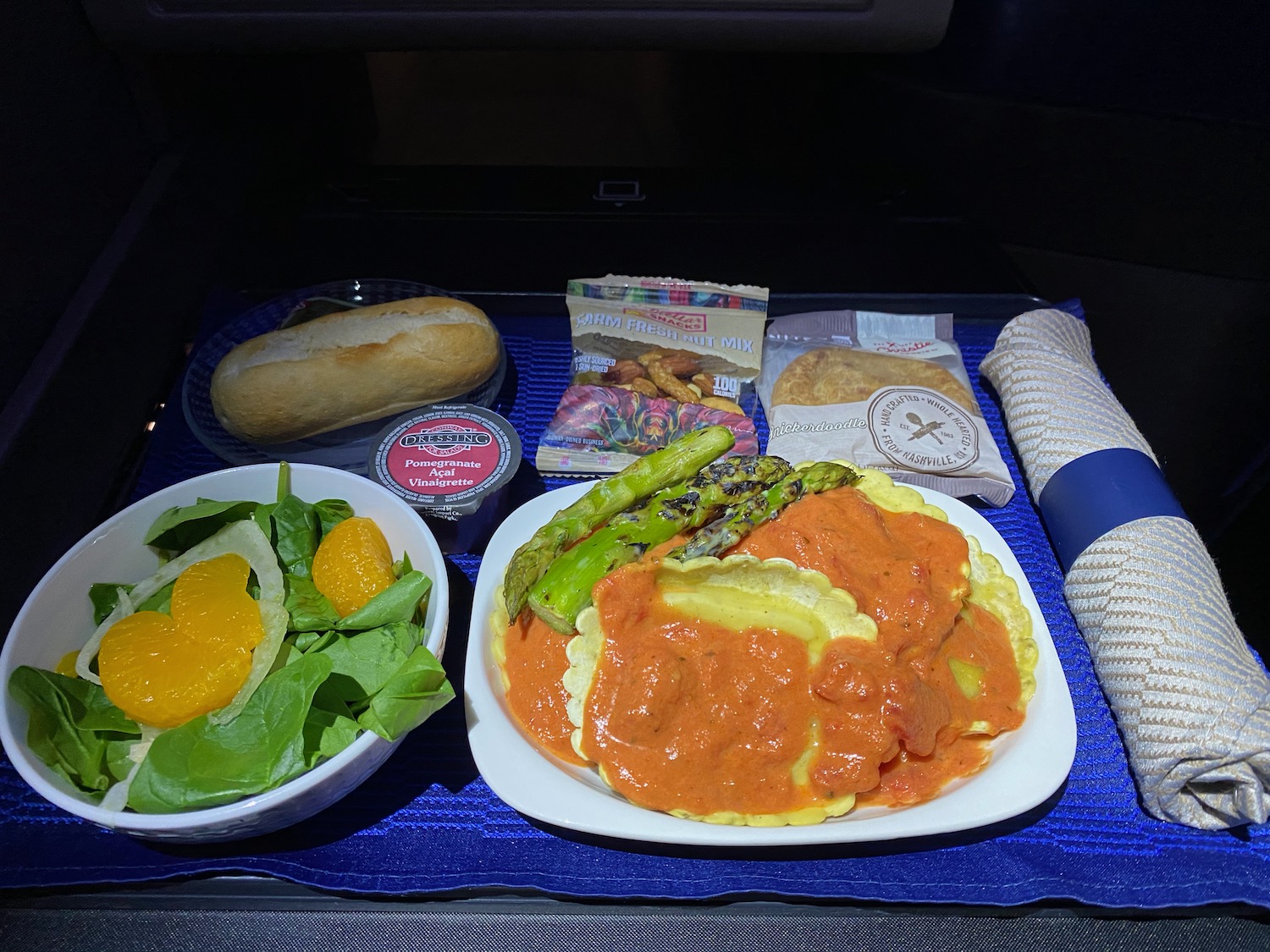 food on a tray with a plate of food