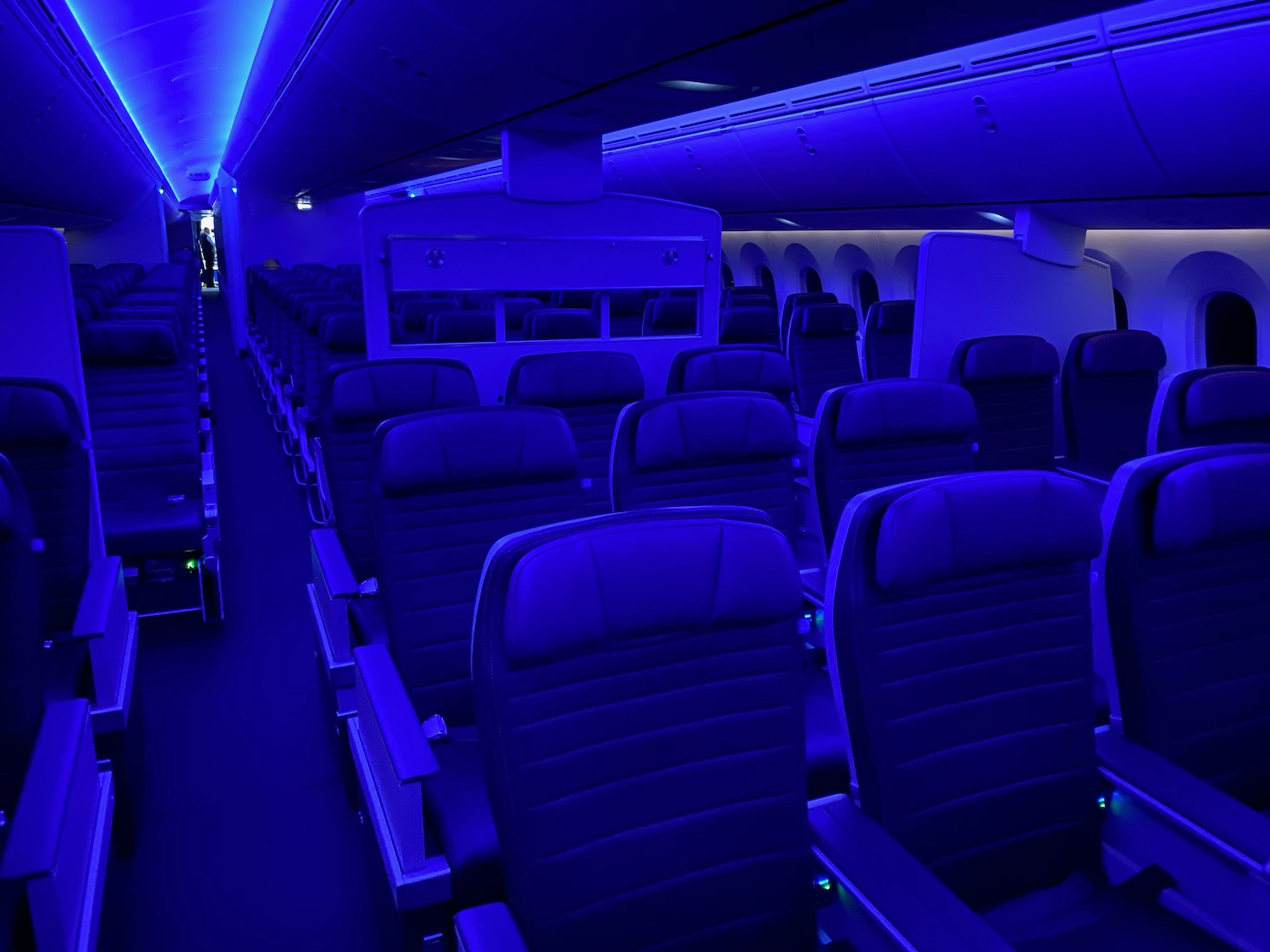 an airplane with seats and a blue light