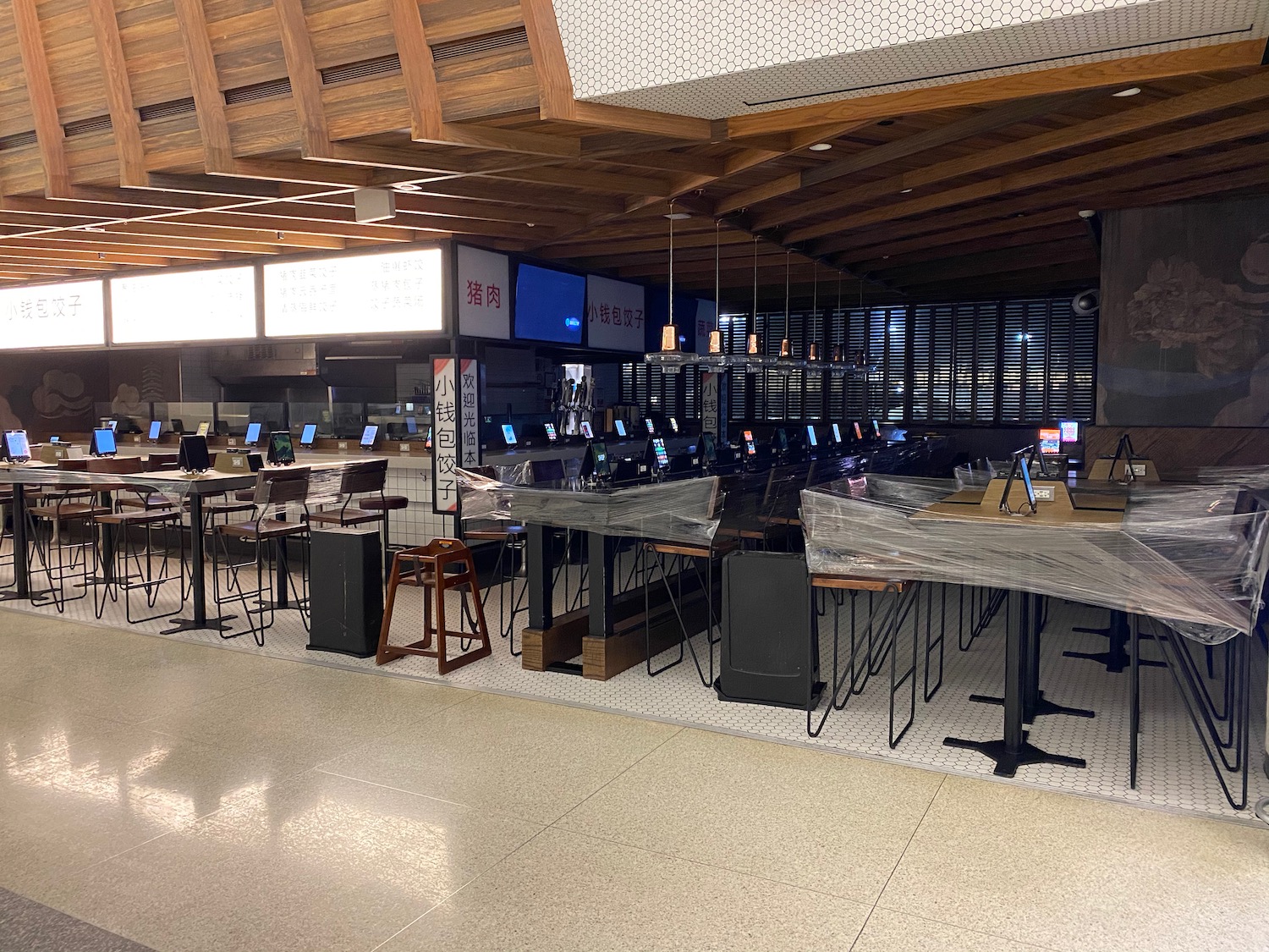 a room with tables and chairs and computers