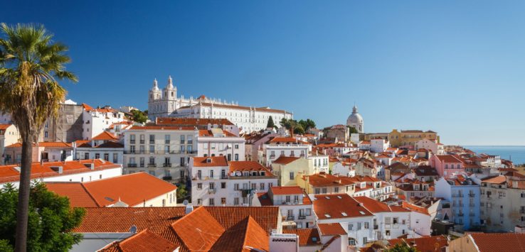 a group of buildings with red roofs