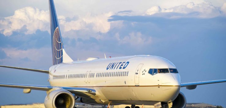 a white airplane on the runway