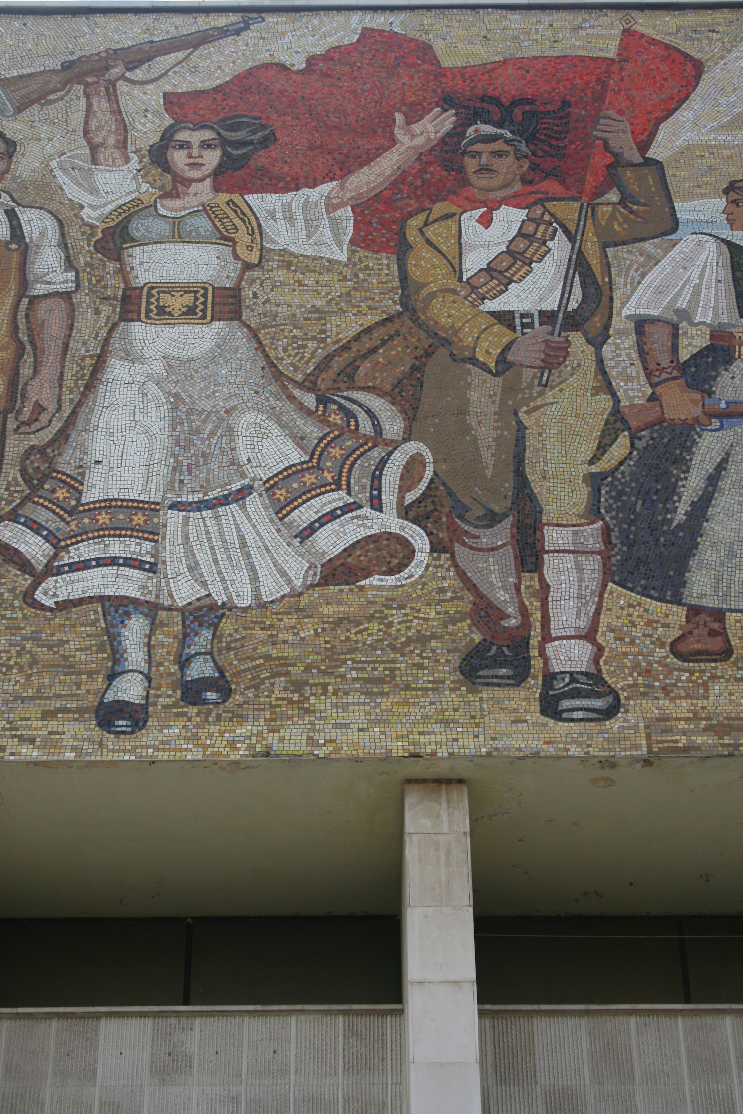 a mosaic of people on a wall