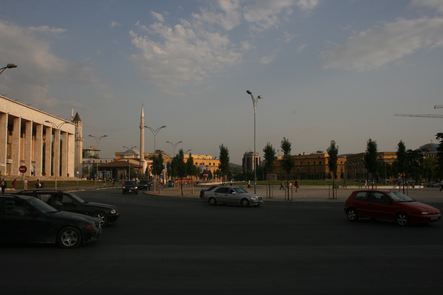 a street with cars and buildings