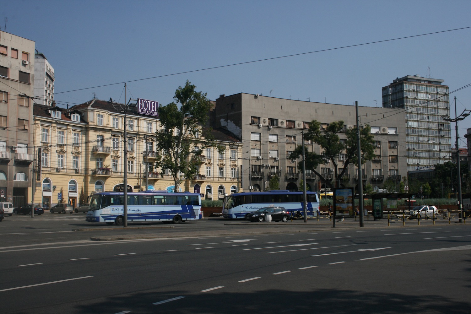 a bus stop in front of a building