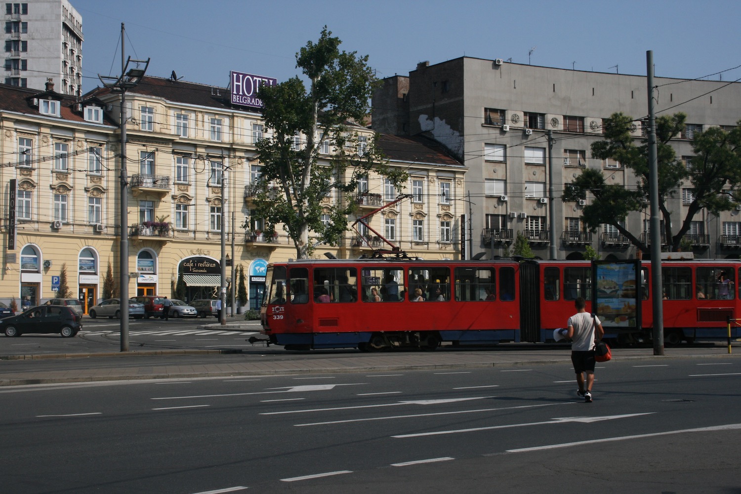 a red trolley on a street