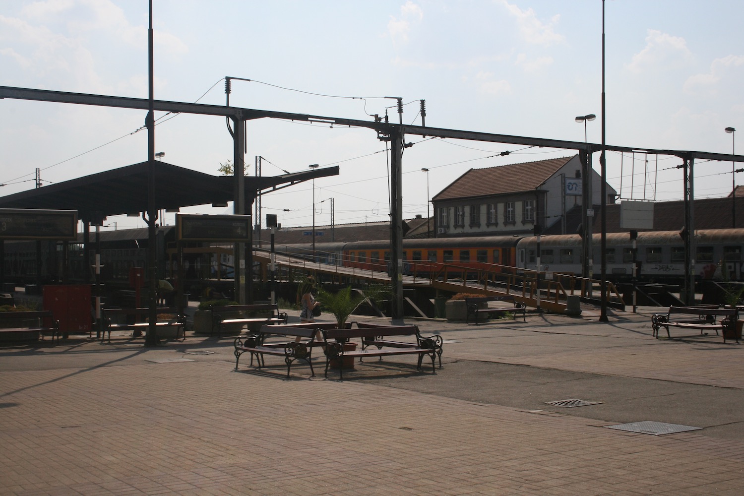 a train station with benches and benches