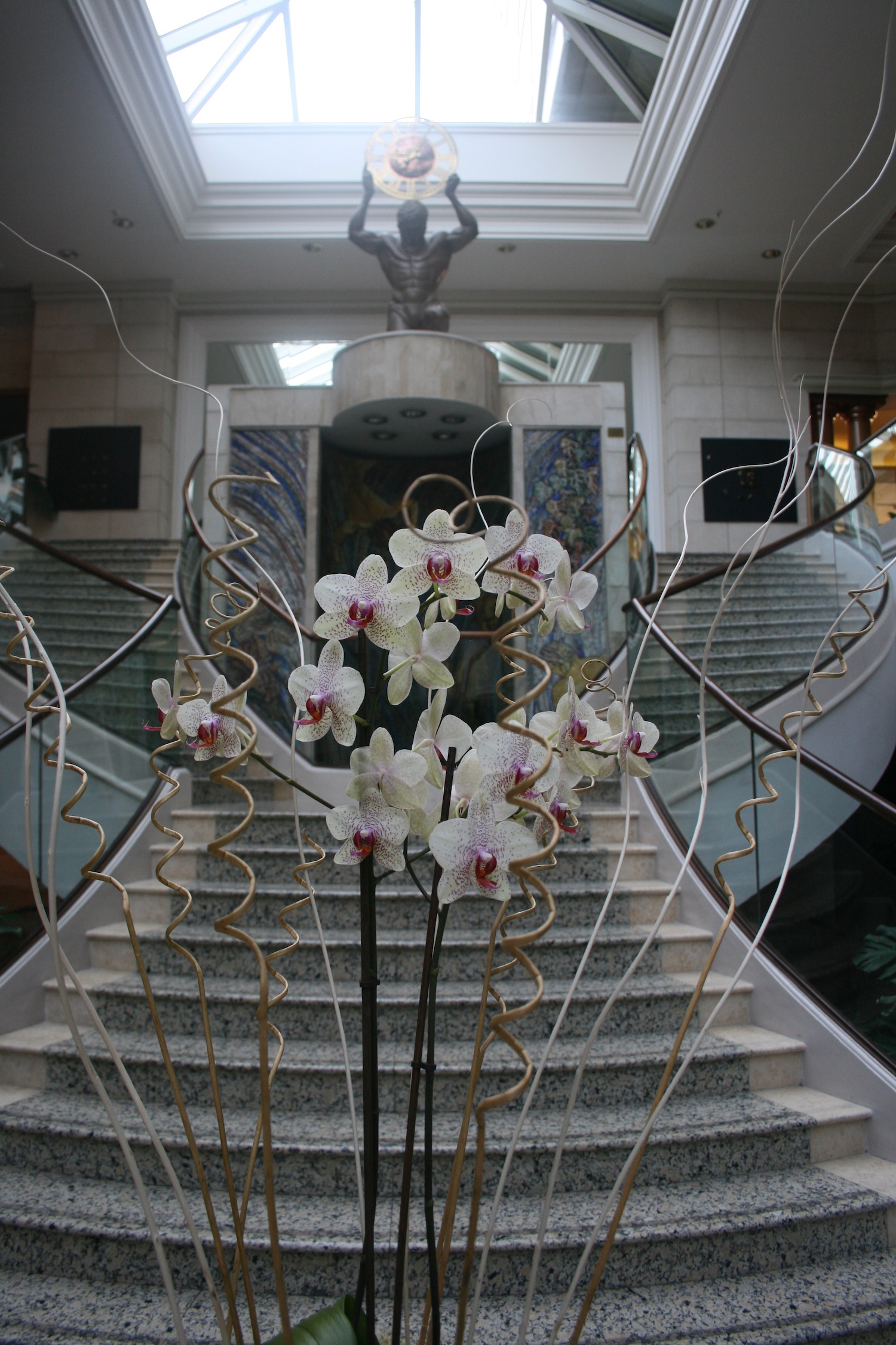 a staircase with white flowers