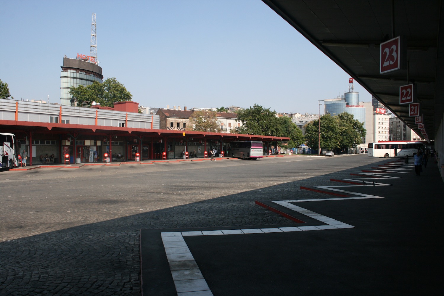 a bus stop in a parking lot