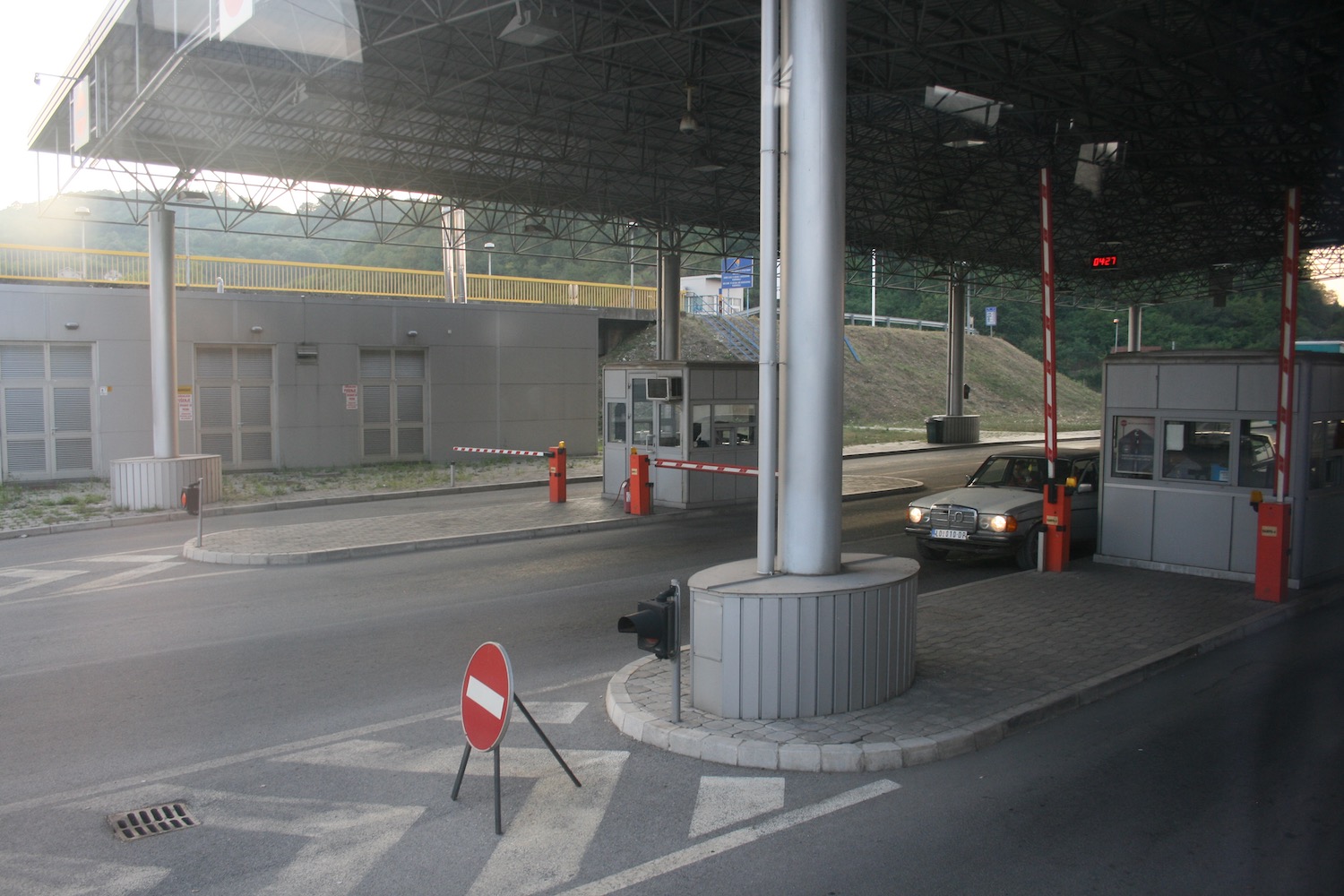 a car parked at a toll booth