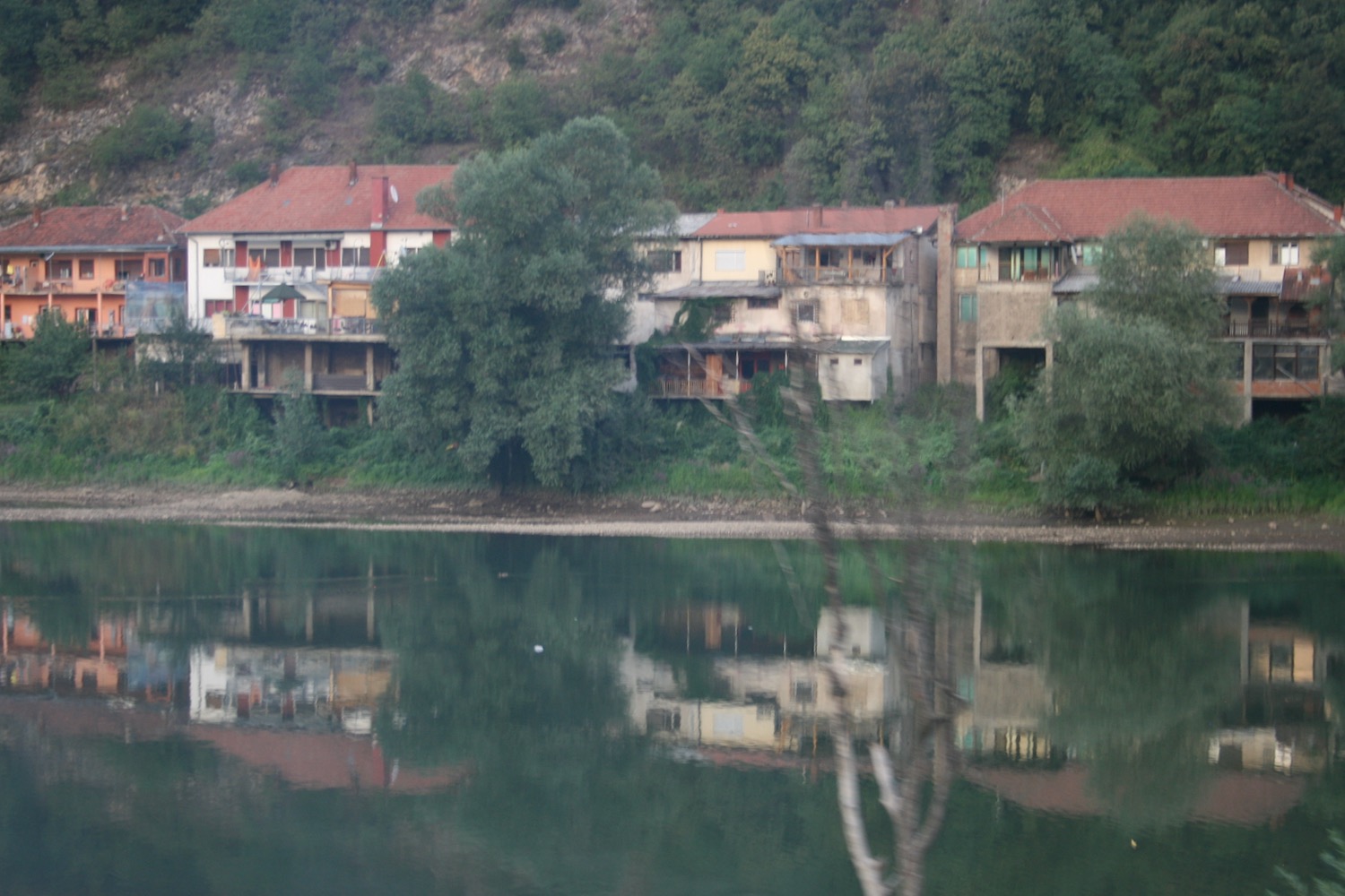 a group of buildings next to a body of water