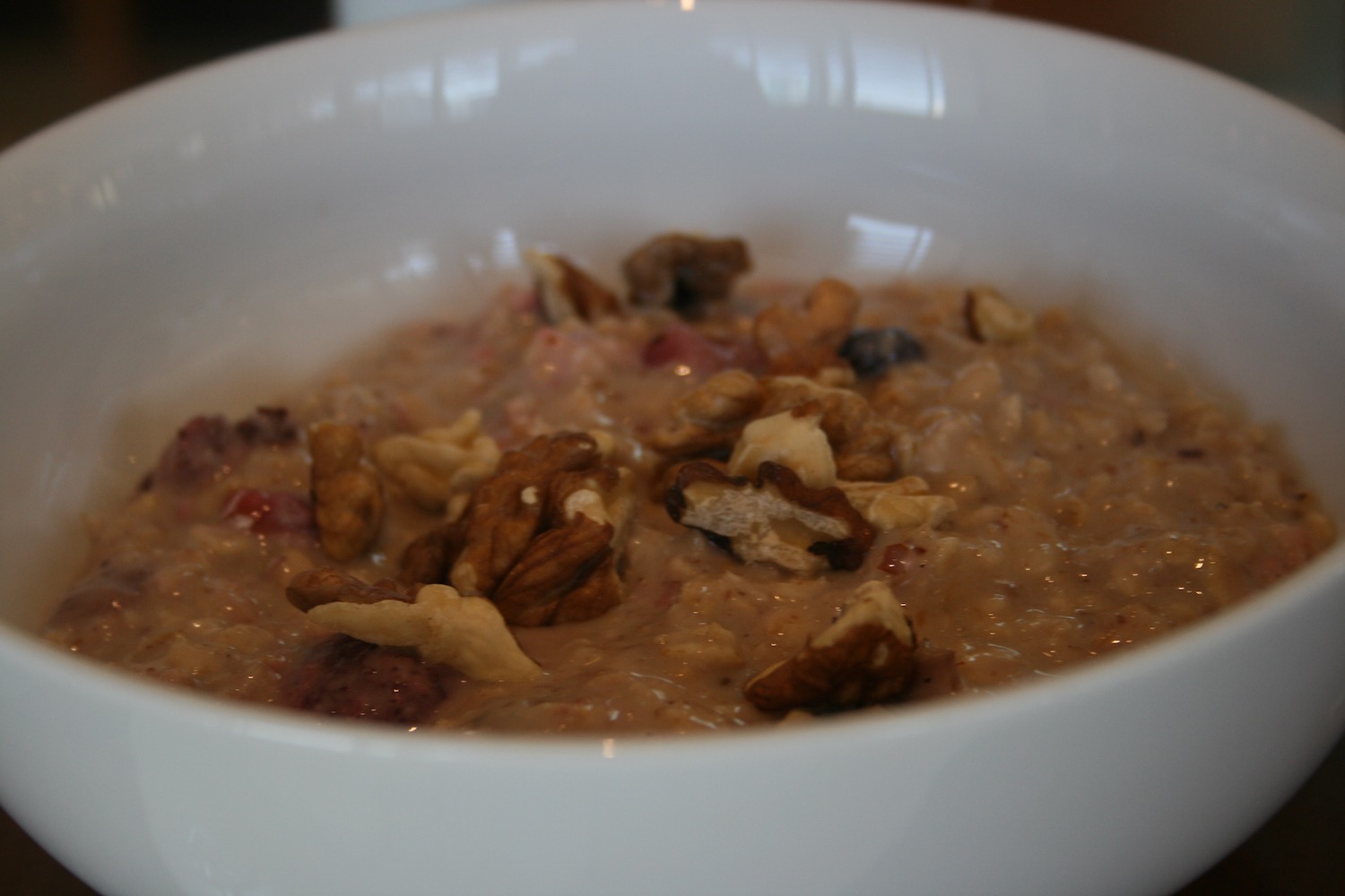 a bowl of oatmeal with nuts