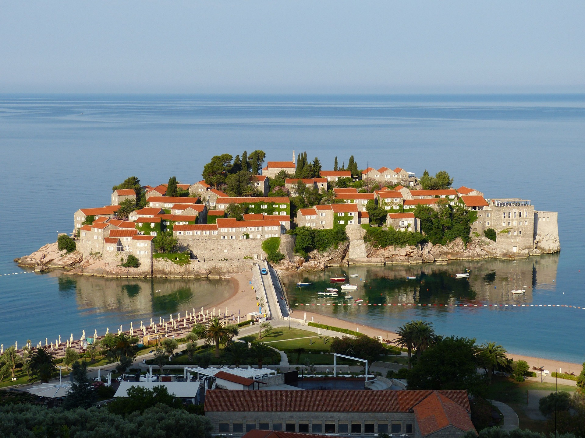 a small island with buildings and trees on it