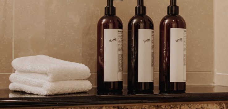 a group of bottles and towels on a counter