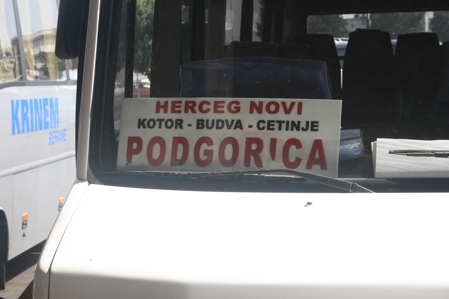 a sign on the windshield of a vehicle