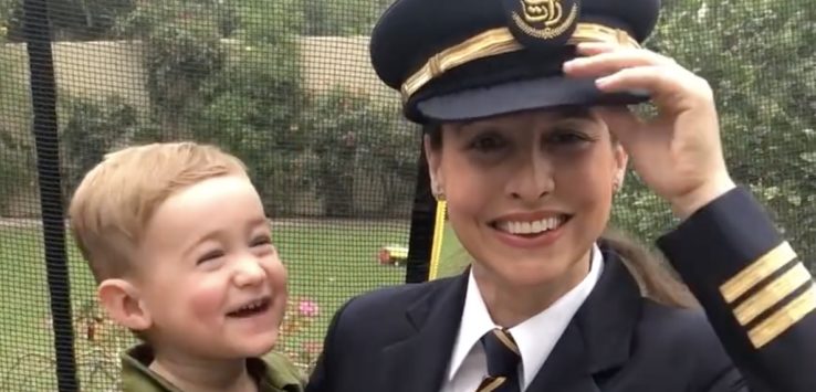 a woman in uniform and a child