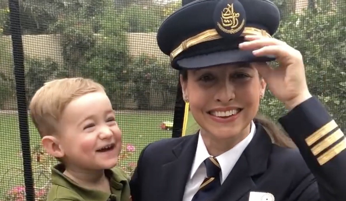 a woman in uniform and a child