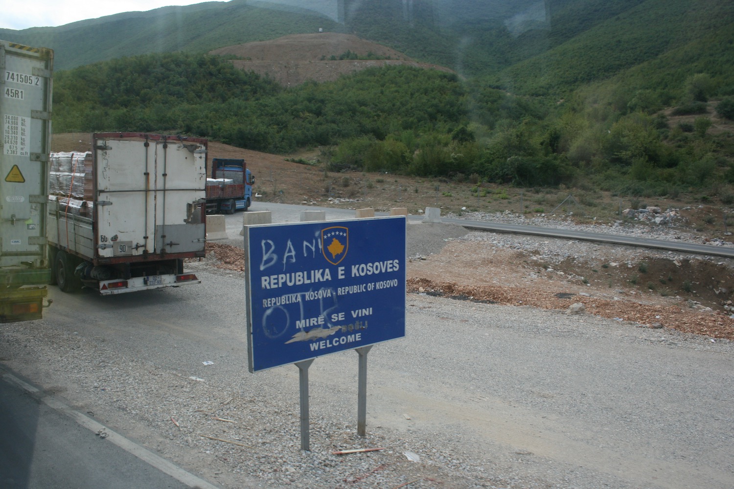 a blue sign on a road