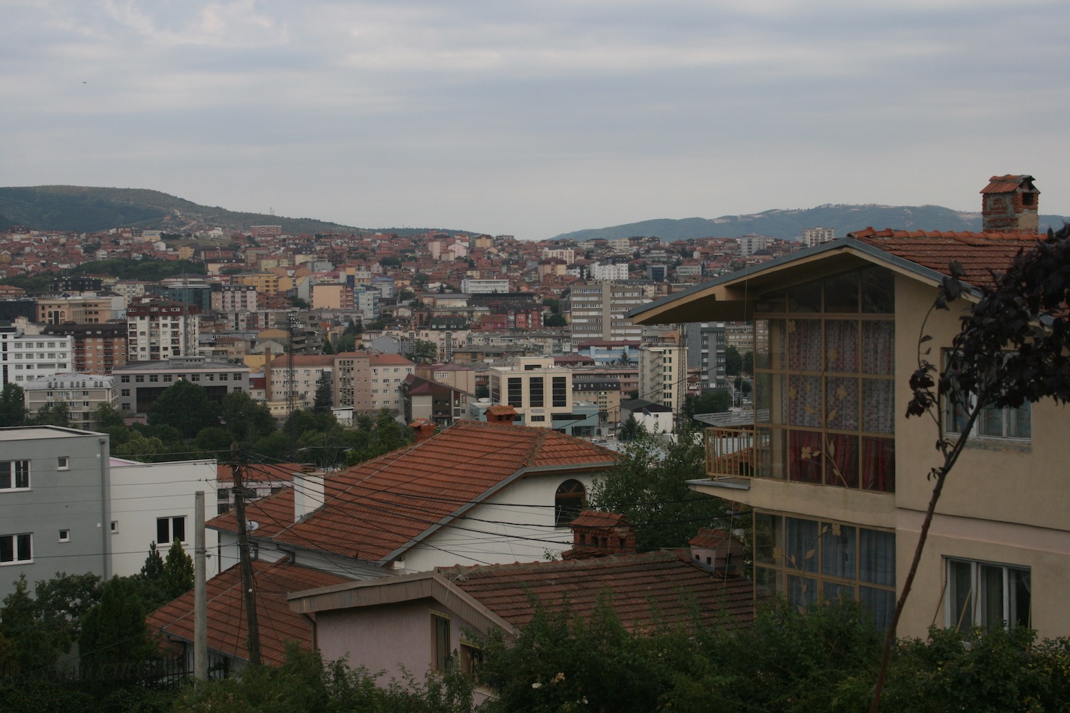 a city with a hill in the background