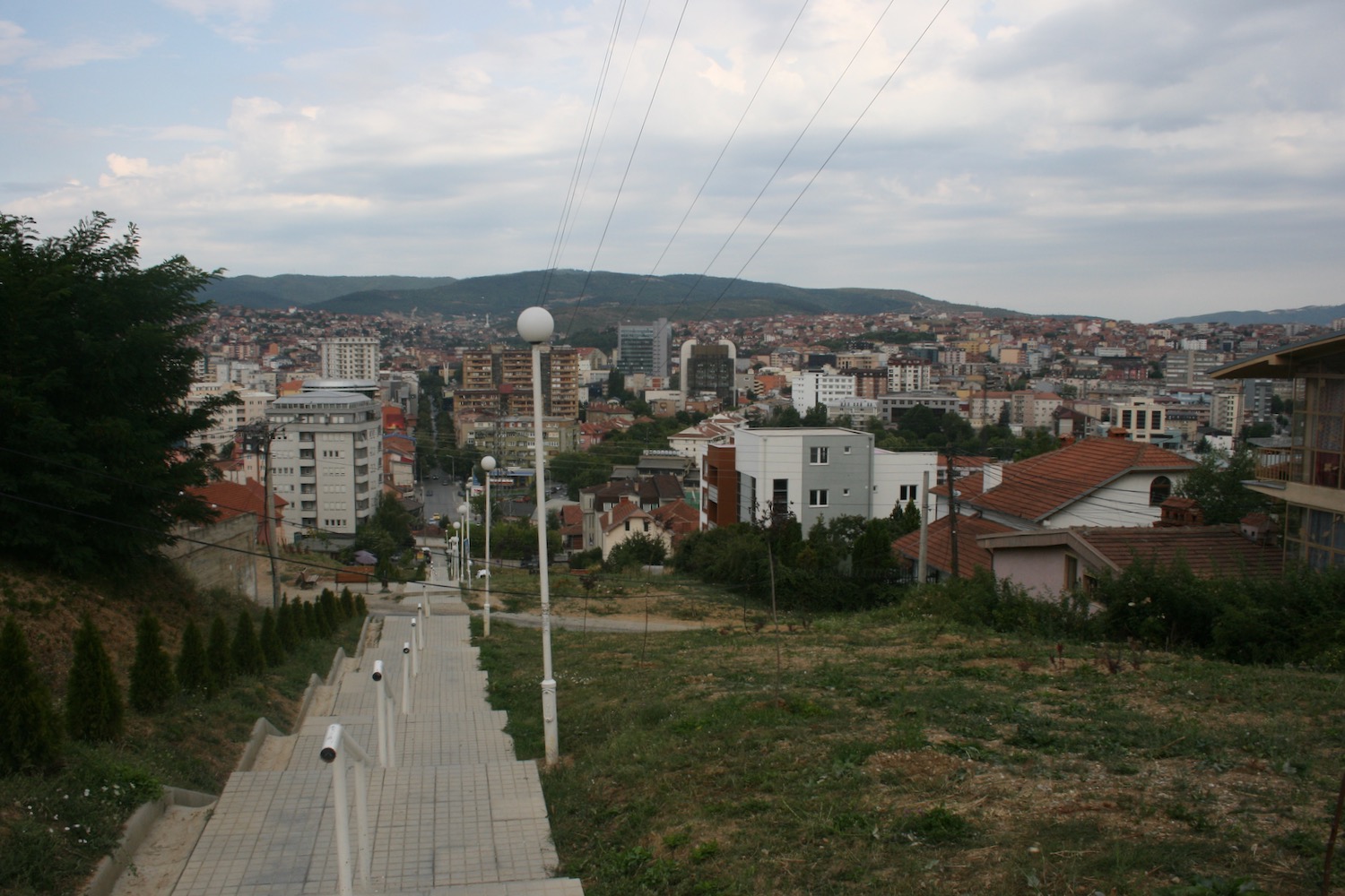 a city with a hill and stairs