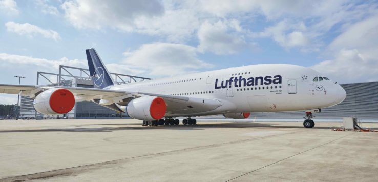 a large white airplane on a runway