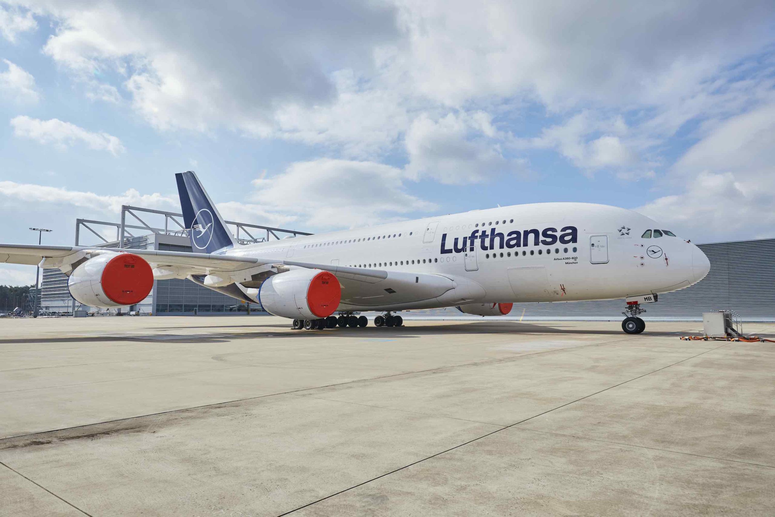 a large white airplane on a runway